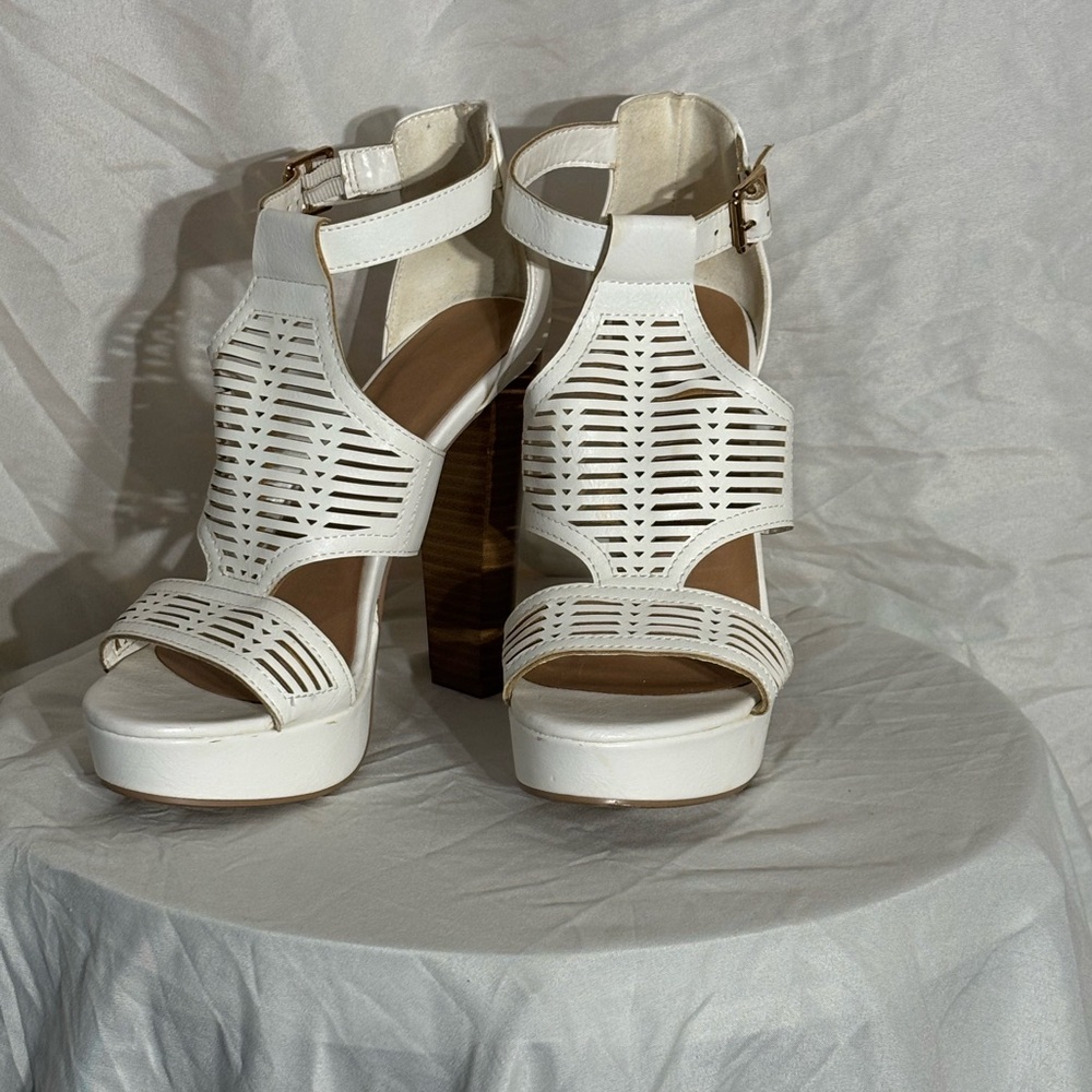 White platform heels with ankle clasp, lightly worn